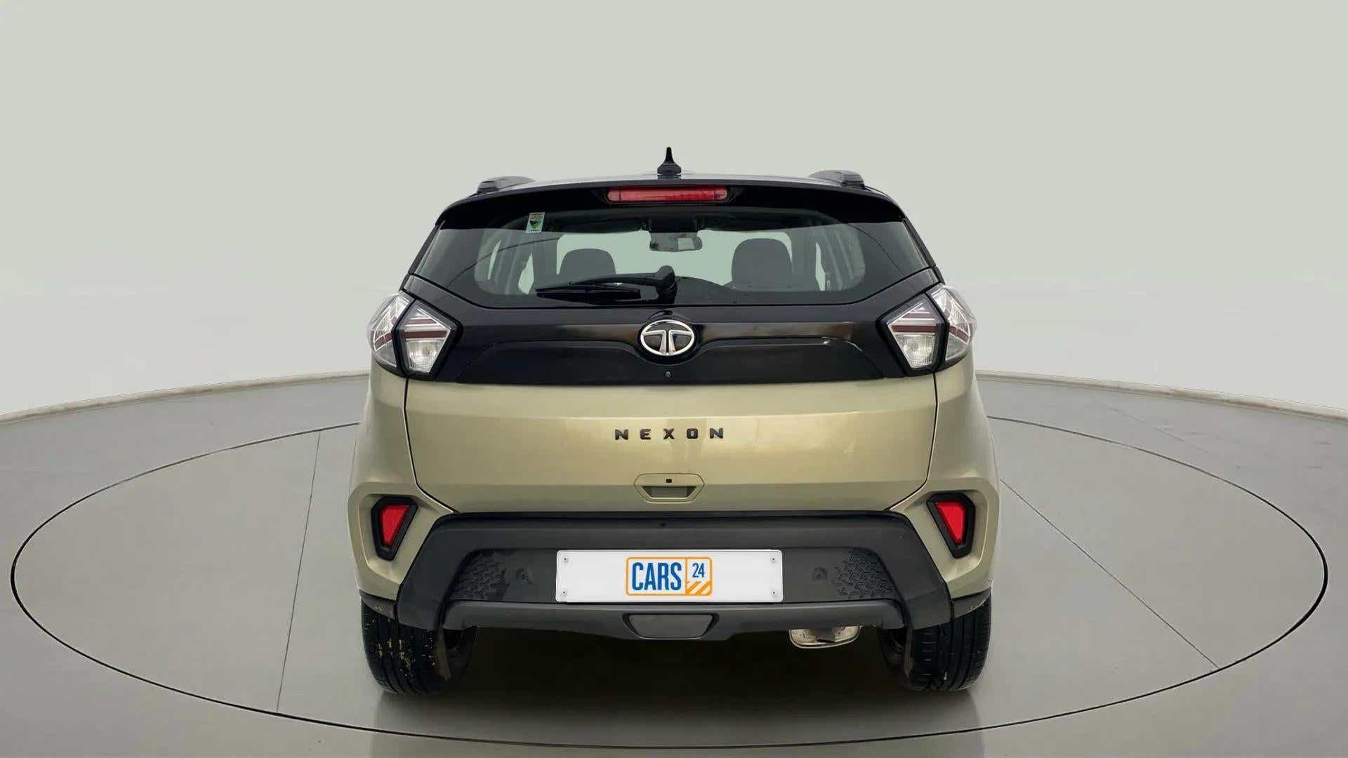 Rear view of a Grassland Beige Tata Nexon 2017-2023
