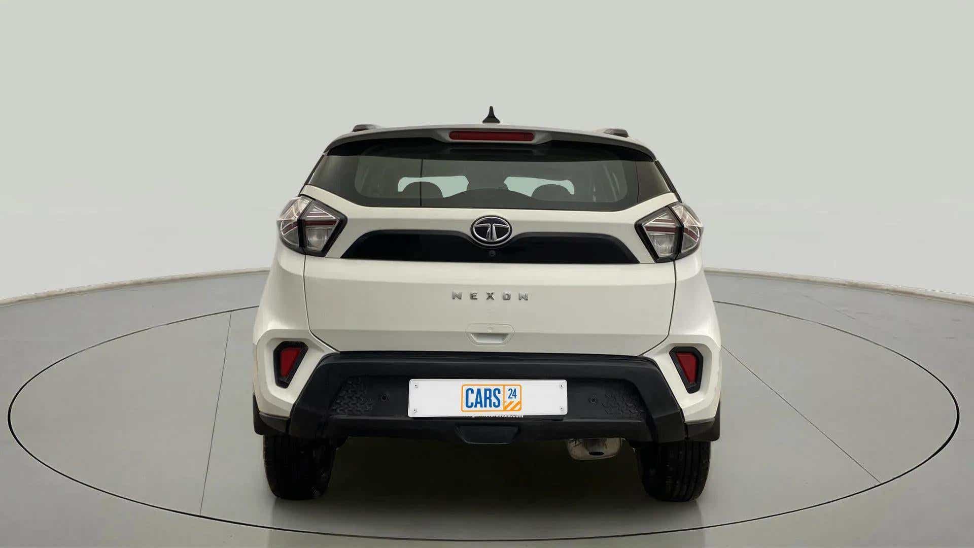 Rear view of a calgary-white Tata Nexon 2017-2023