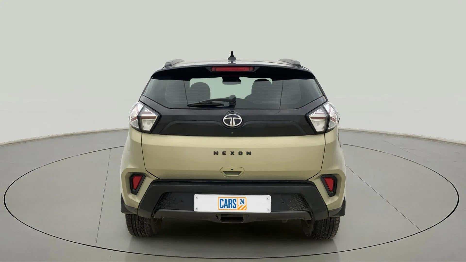Rear view of a Grassland Beige Tata Nexon 2017-2023