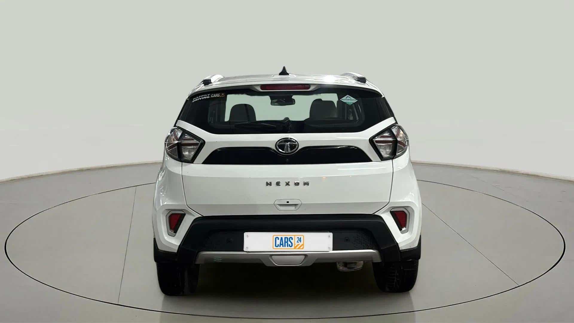 Rear view of a calgary-white Tata Nexon 2017-2023