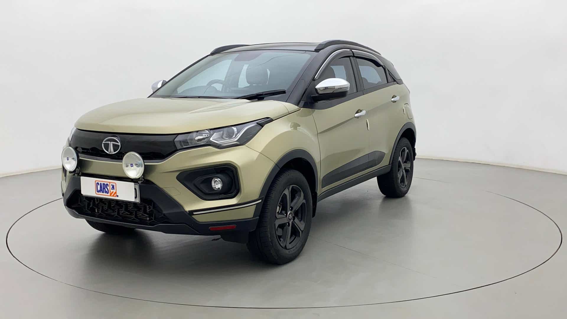 Front three-quarter view of a Grassland Beige Tata Nexon 2017-2023