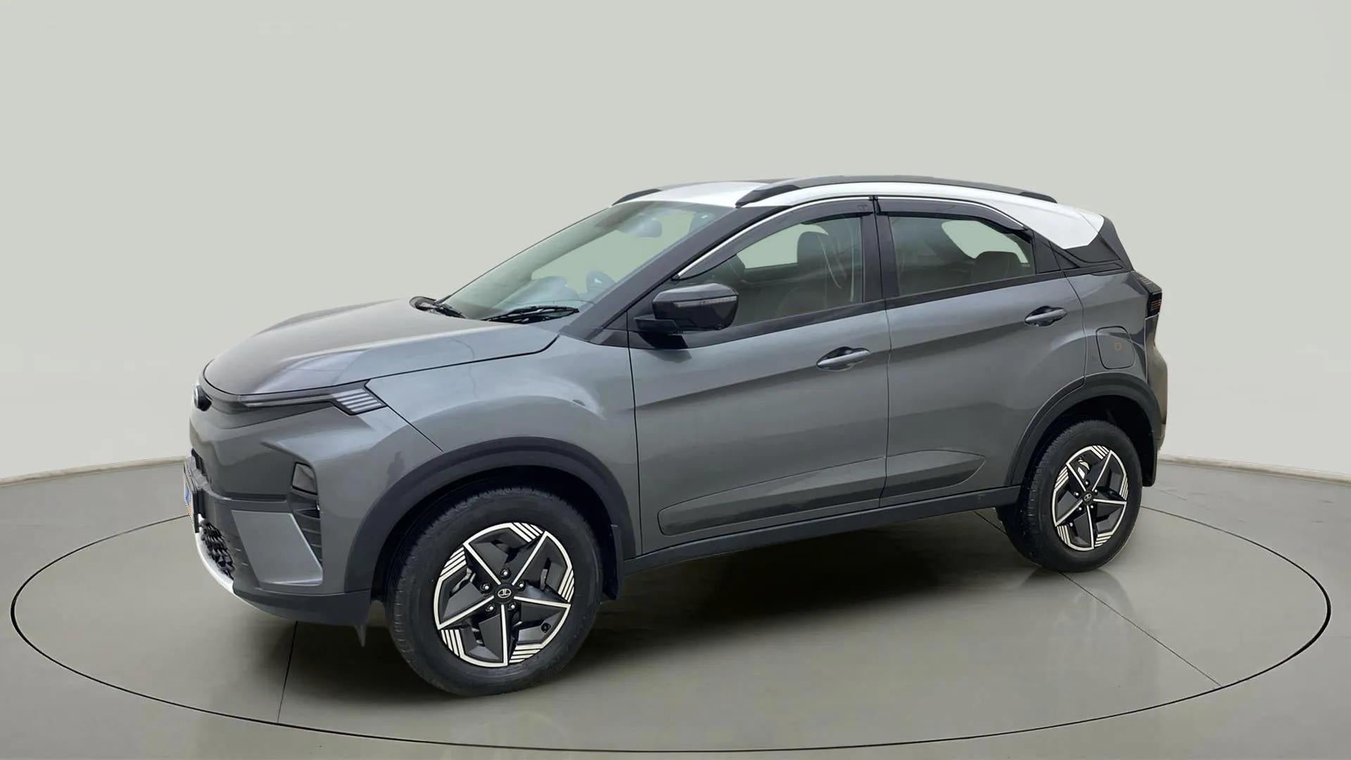 Front side view of a daytona-grey Tata Nexon