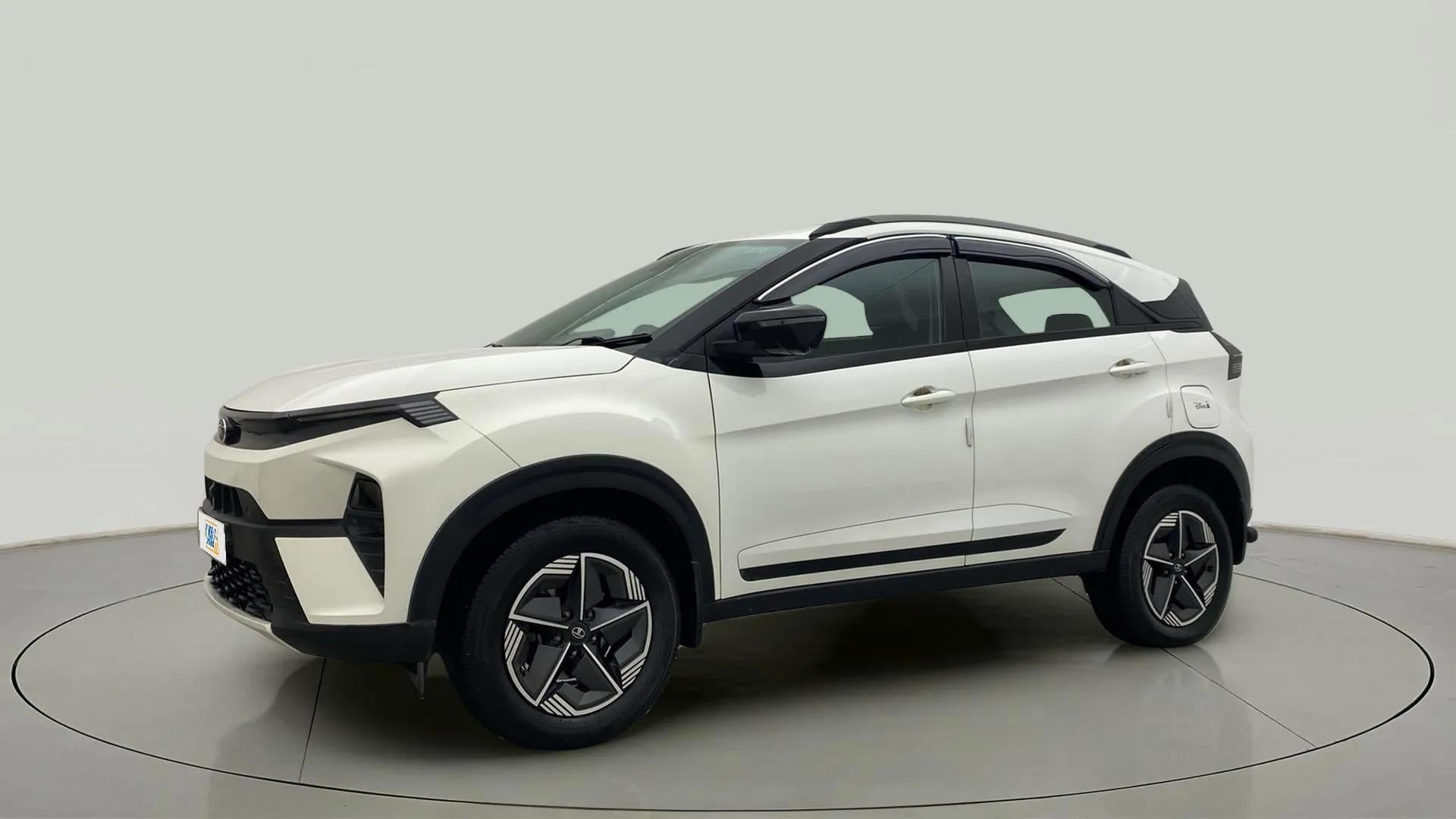Side view of a Calgary White Tata Nexon 2017-2023