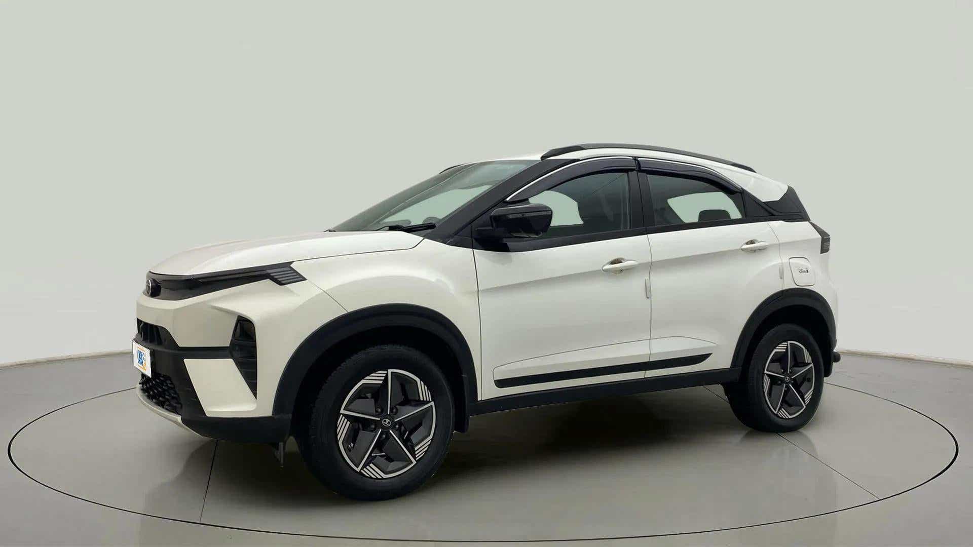 Side view of a Calgary White Tata Nexon 2017-2023