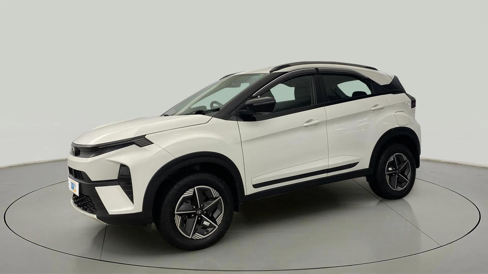 Front three-quarter view of a Calgary White Tata Nexon