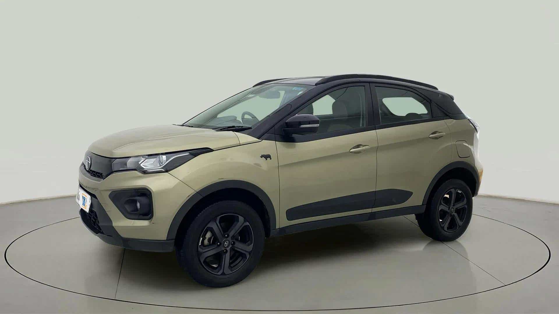 Front three-quarter view of a Grassland Beige Tata Nexon 2017-2023