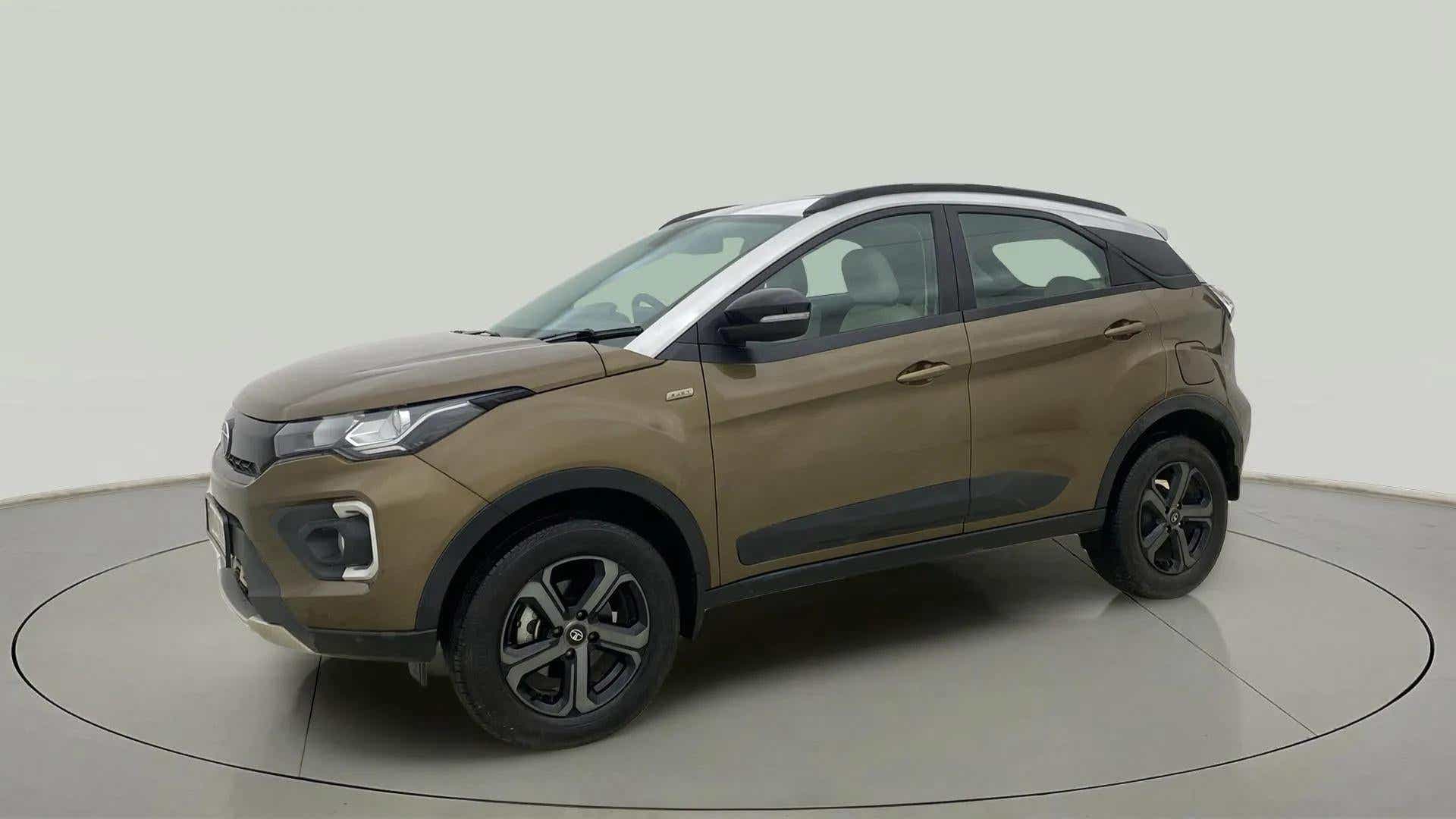 Front three-quarter view of a Grassland Beige Tata Nexon 2017-2023