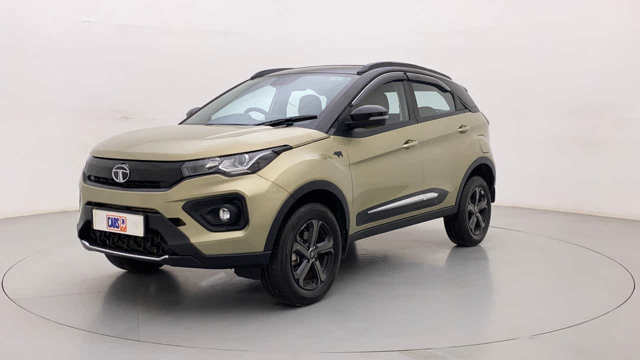 Front three-quarter view of a Grassland Beige Tata Nexon 2017-2023