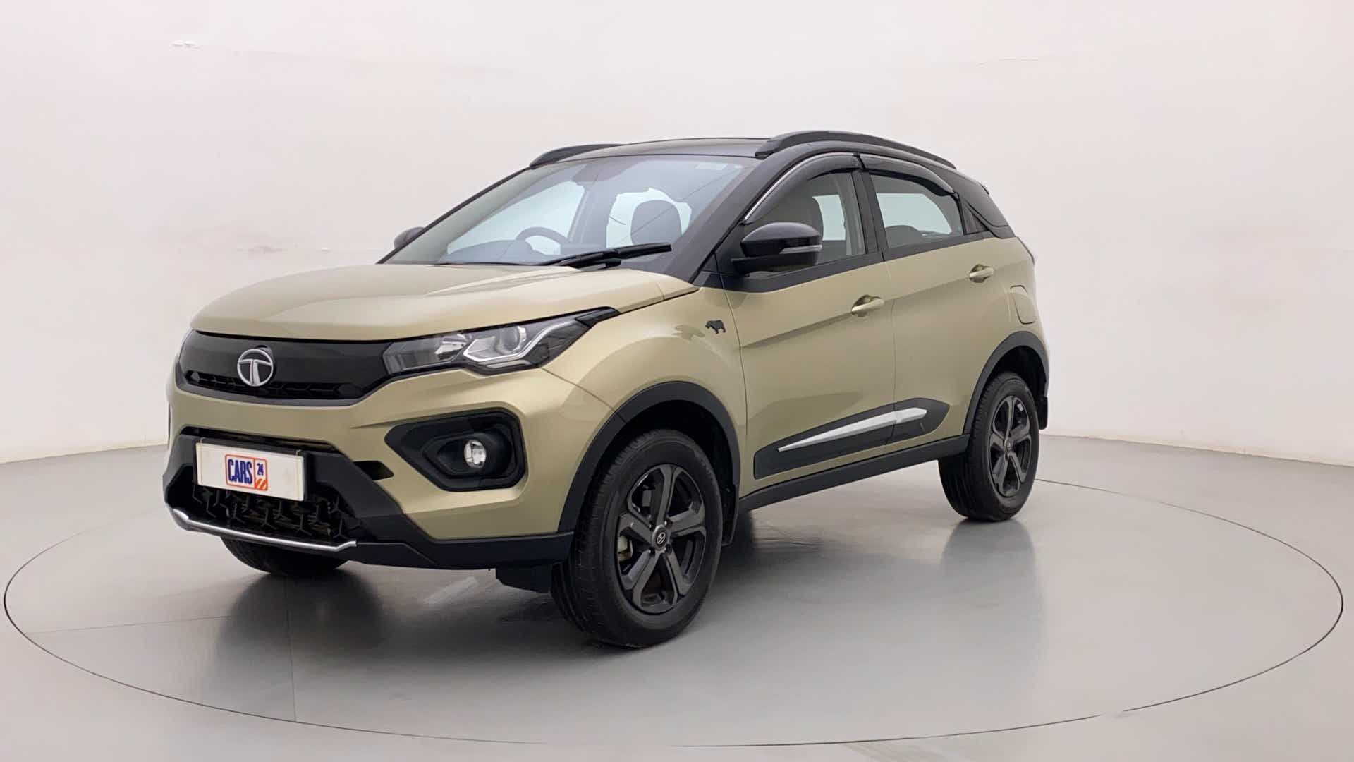 Front three-quarter view of a Grassland Beige Tata Nexon 2017-2023