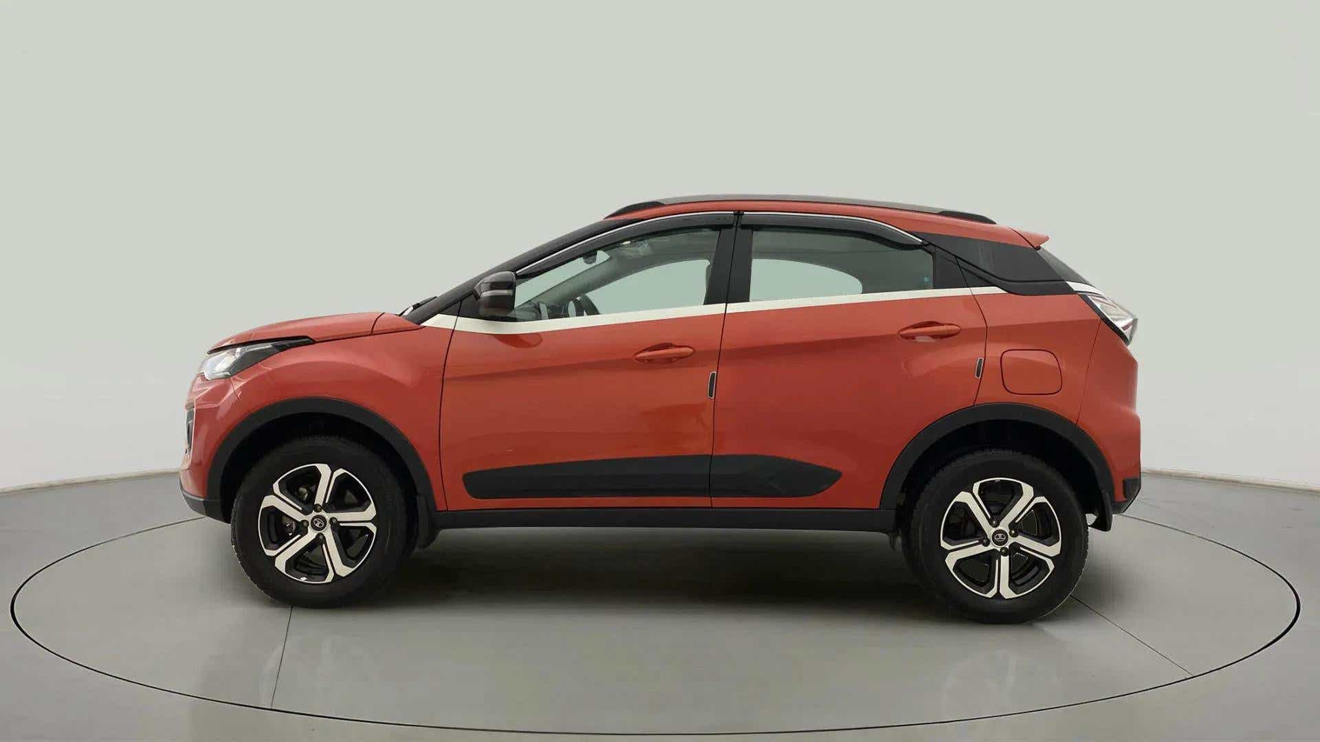 Side profile of a Flame Red Tata Nexon 2017-2023
