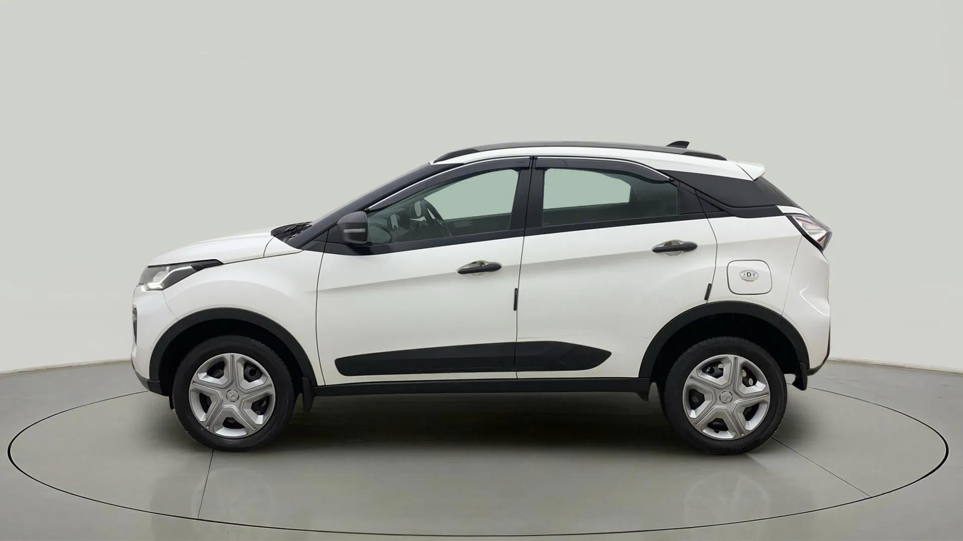Side view of a calgary-white Tata Nexon 2017-2023