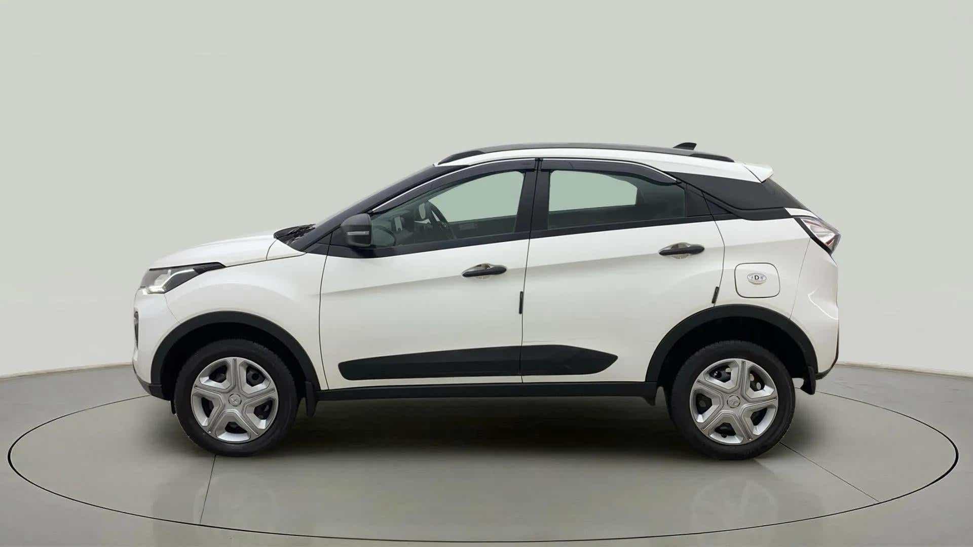 Side view of a calgary-white Tata Nexon 2017-2023