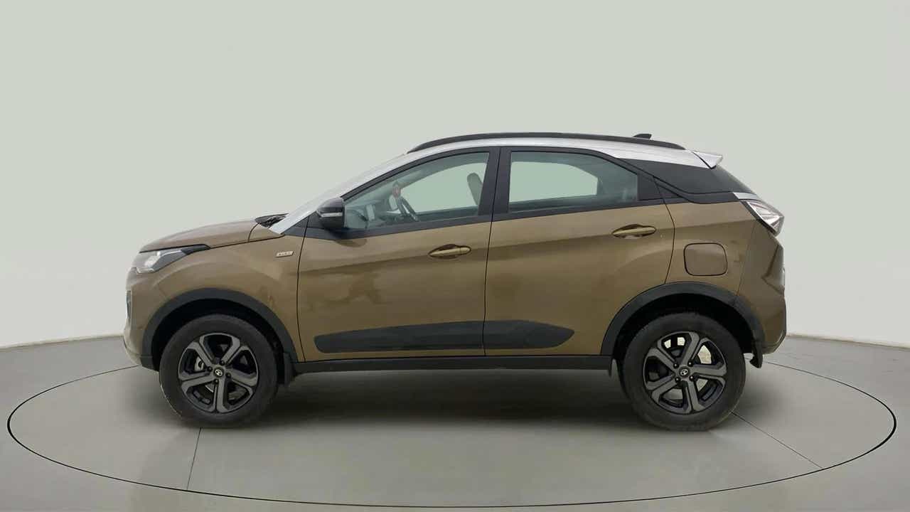 Side view of a Grassland Beige Tata Nexon 2017-2023