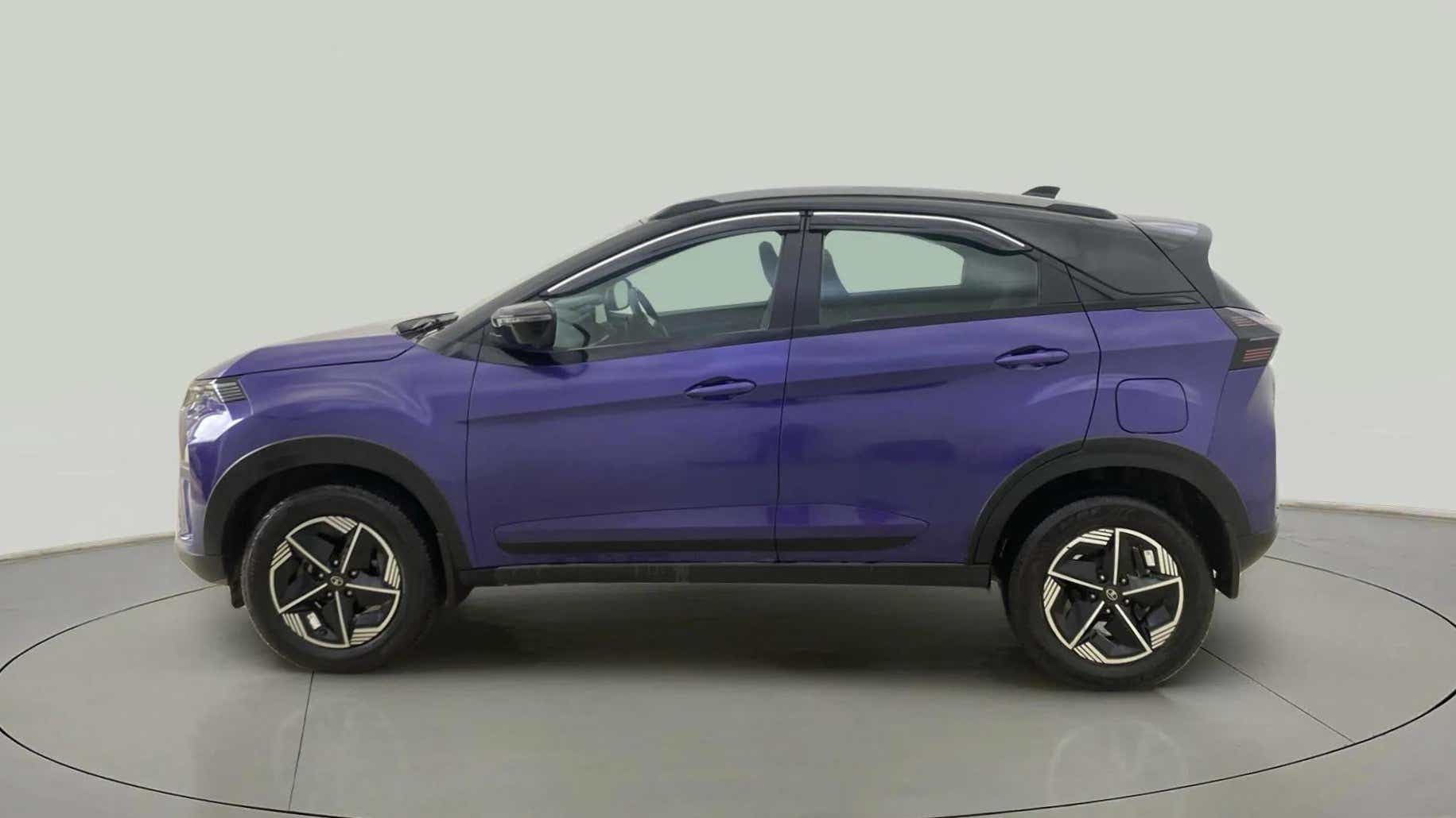 Side view of a Royal Blue Tata Nexon