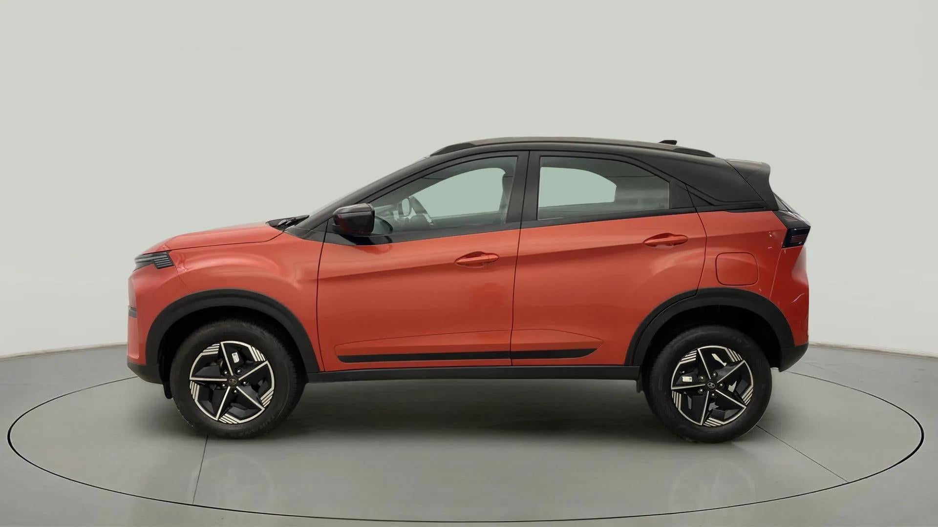 Side view of a flame red Tata Nexon 2017-2023