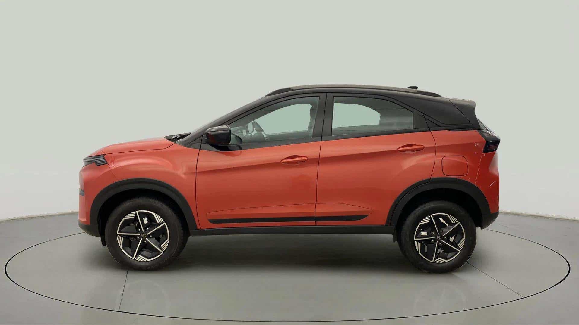 Side view of a flame red Tata Nexon 2017-2023