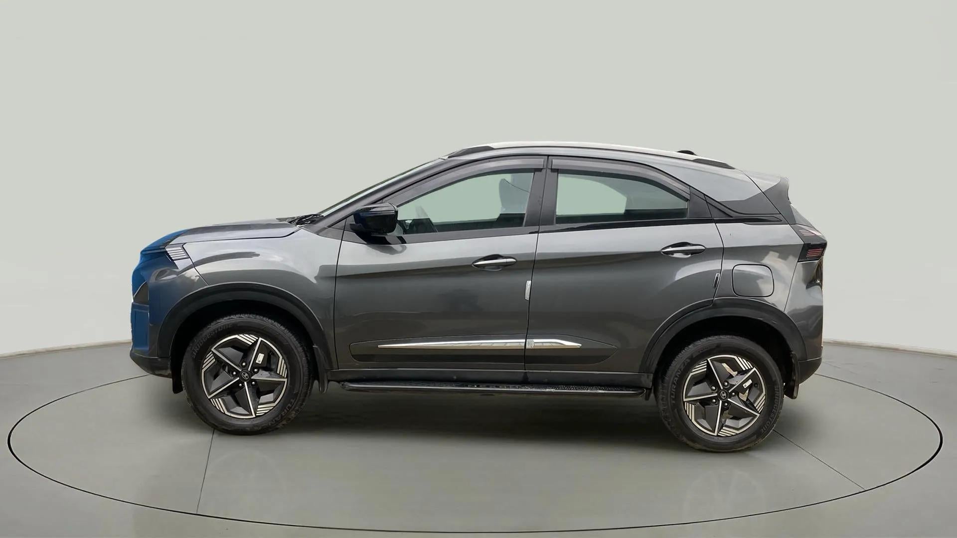 Side view of a daytona-grey Tata Nexon