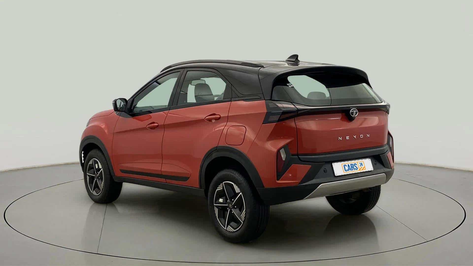 Rear three-quarter view of a Flame Red Tata Nexon 2017-2023