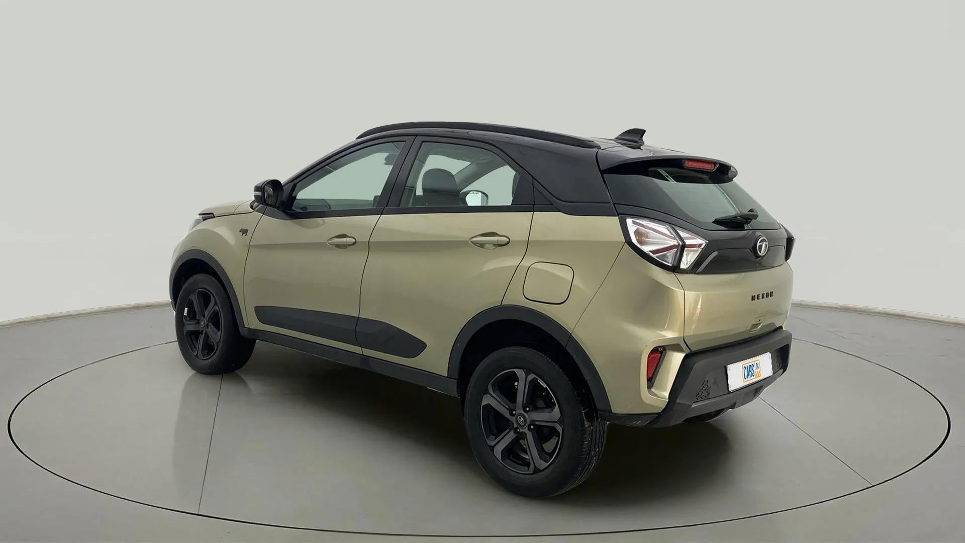Rear three-quarter view of a Grassland Beige Tata Nexon 2017-2023