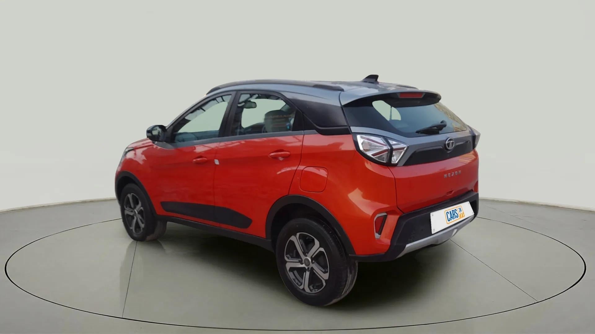 Rear three-quarter view of a Flame Red Tata Nexon 2017-2023