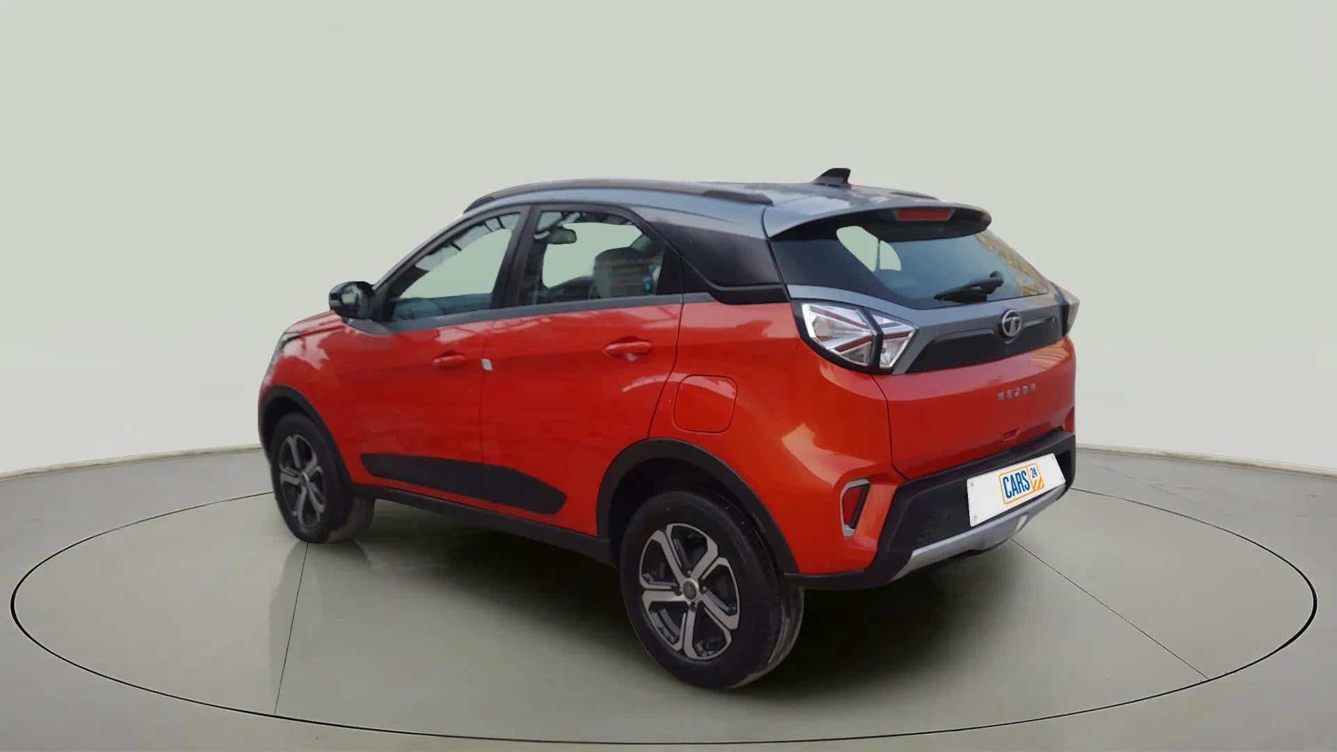 Rear three-quarter view of a Flame Red Tata Nexon 2017-2023