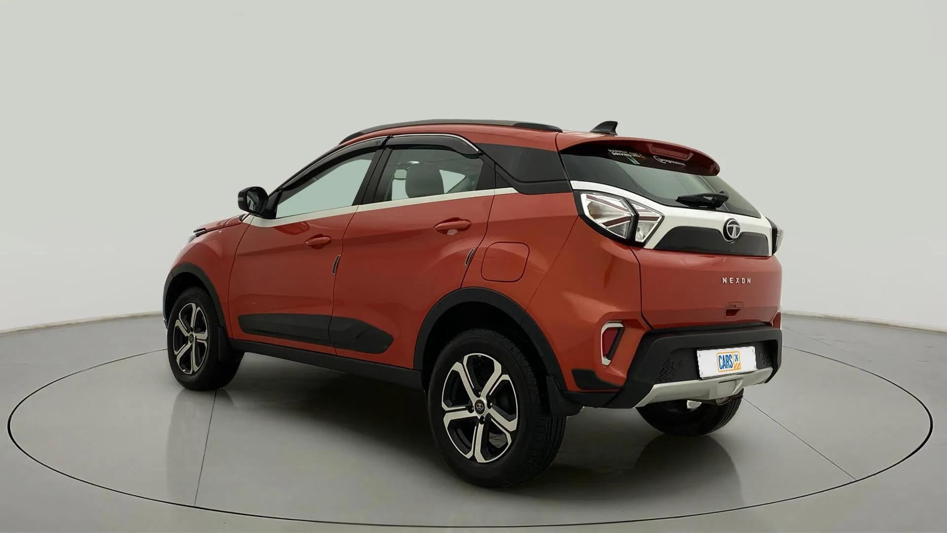 Rear three-quarter view of a Flame Red Tata Nexon 2017-2023