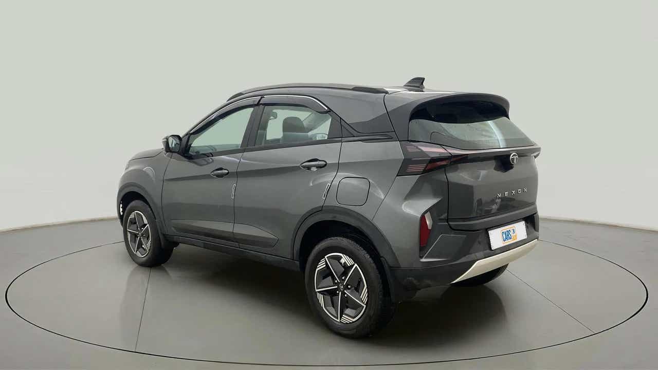 Rear three-quarter view of a daytona-grey Tata Nexon