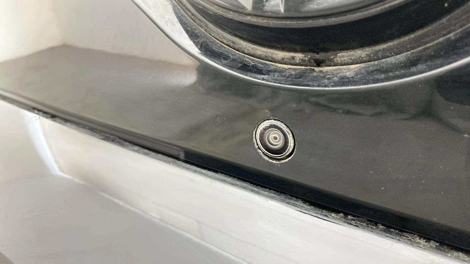 Close-up of a headlight area with camera on a Tata Nexon 2017-2023