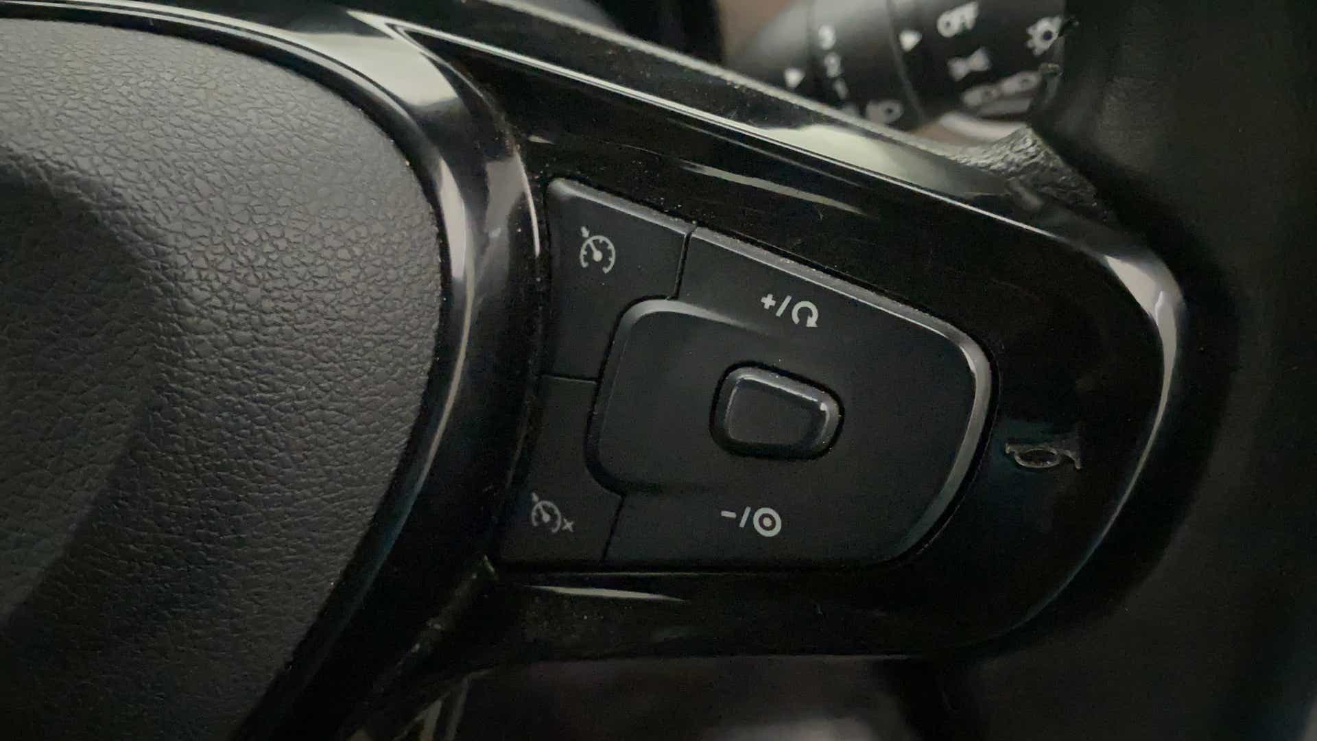 Steering wheel cruise control buttons of a Tata Nexon 2017-2023