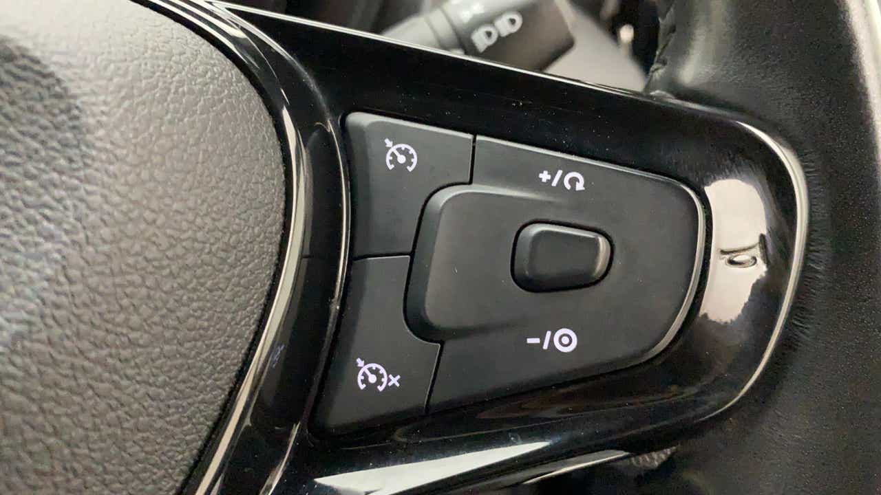 Steering wheel cruise control buttons of a Tata Nexon 2017-2023