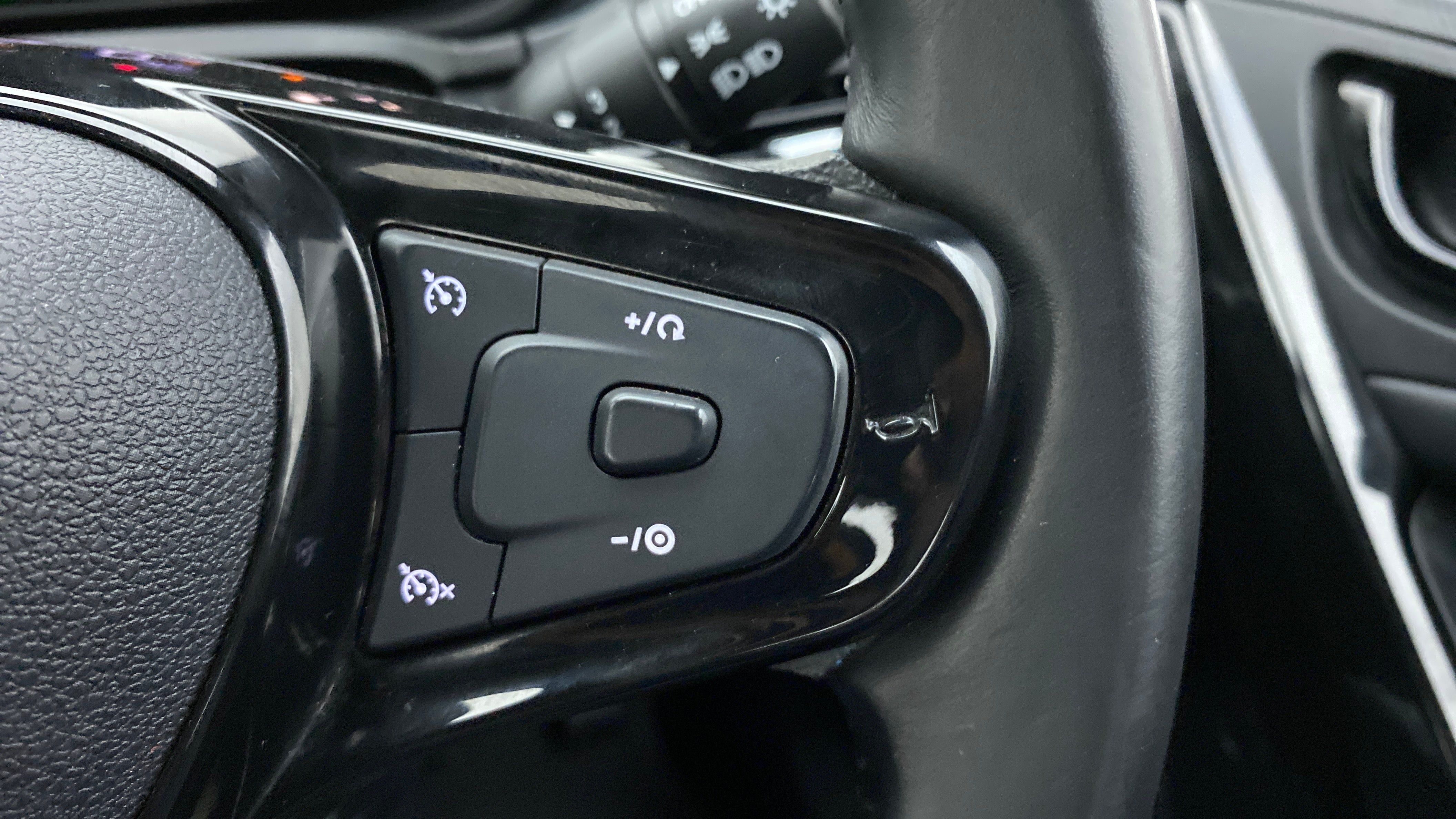Steering wheel cruise control buttons of a Tata Nexon 2017-2023