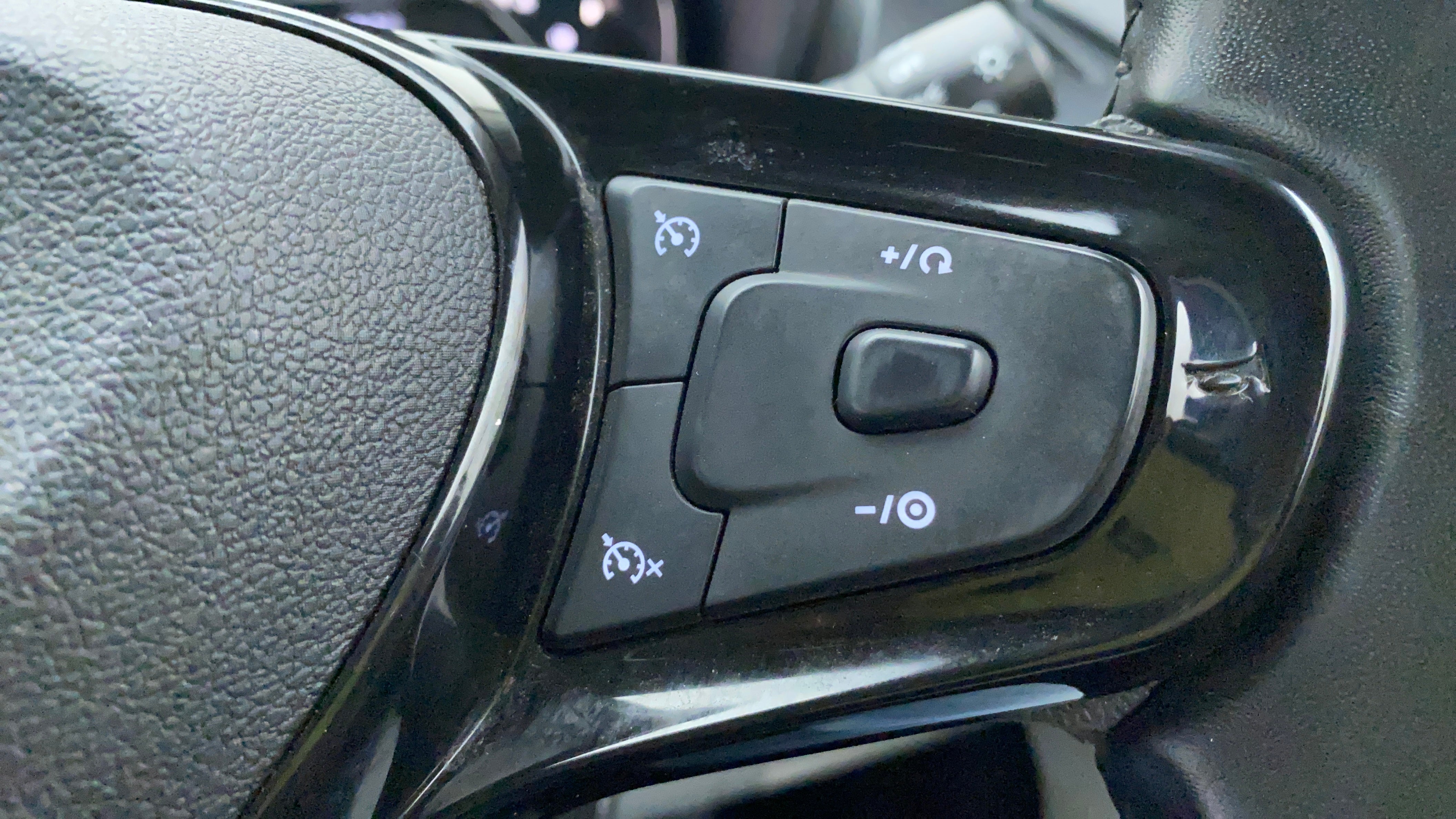 Cruise control buttons on the steering wheel of a Tata Nexon 2017-2023