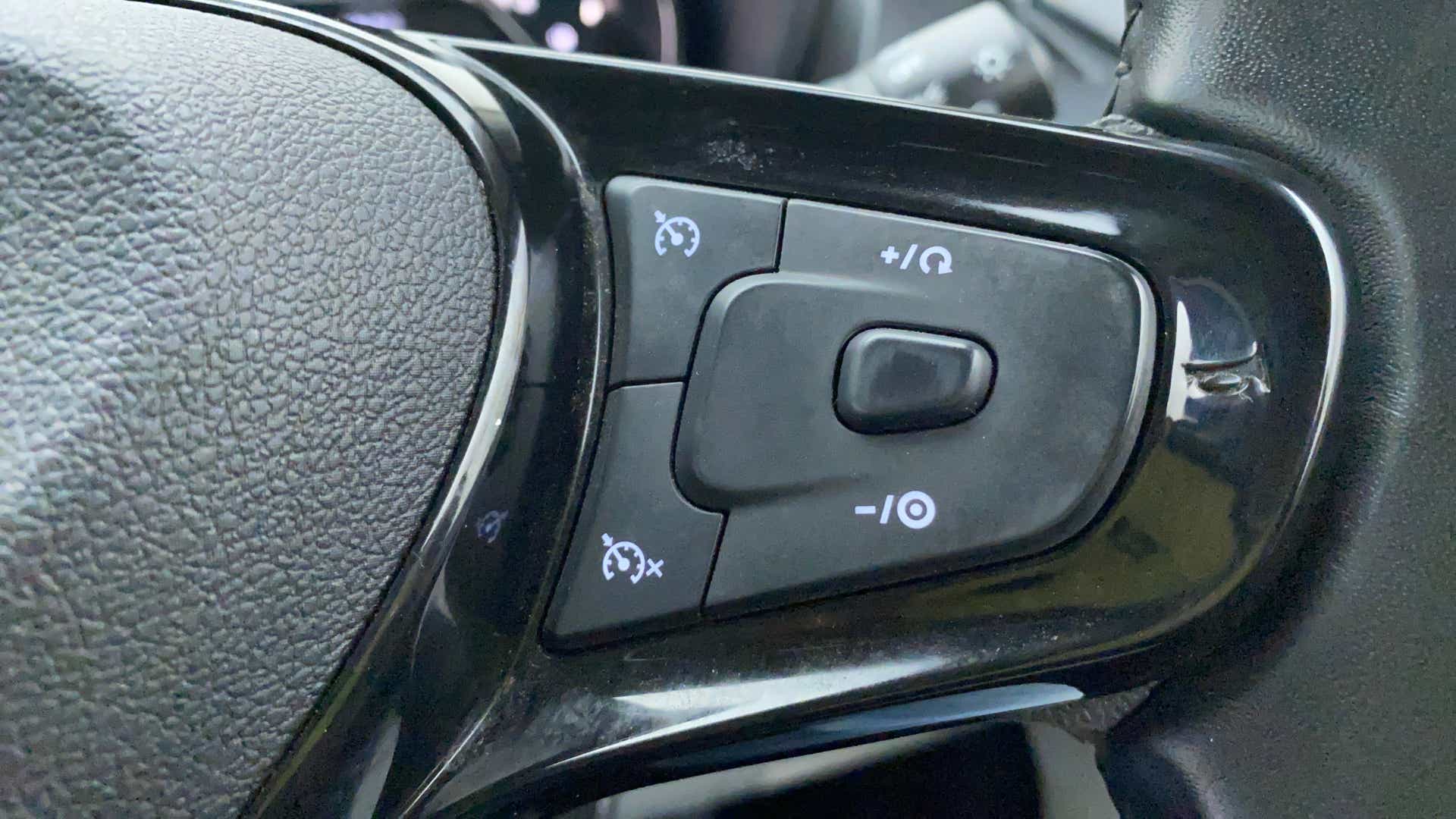 Cruise control buttons on the steering wheel of a Tata Nexon 2017-2023
