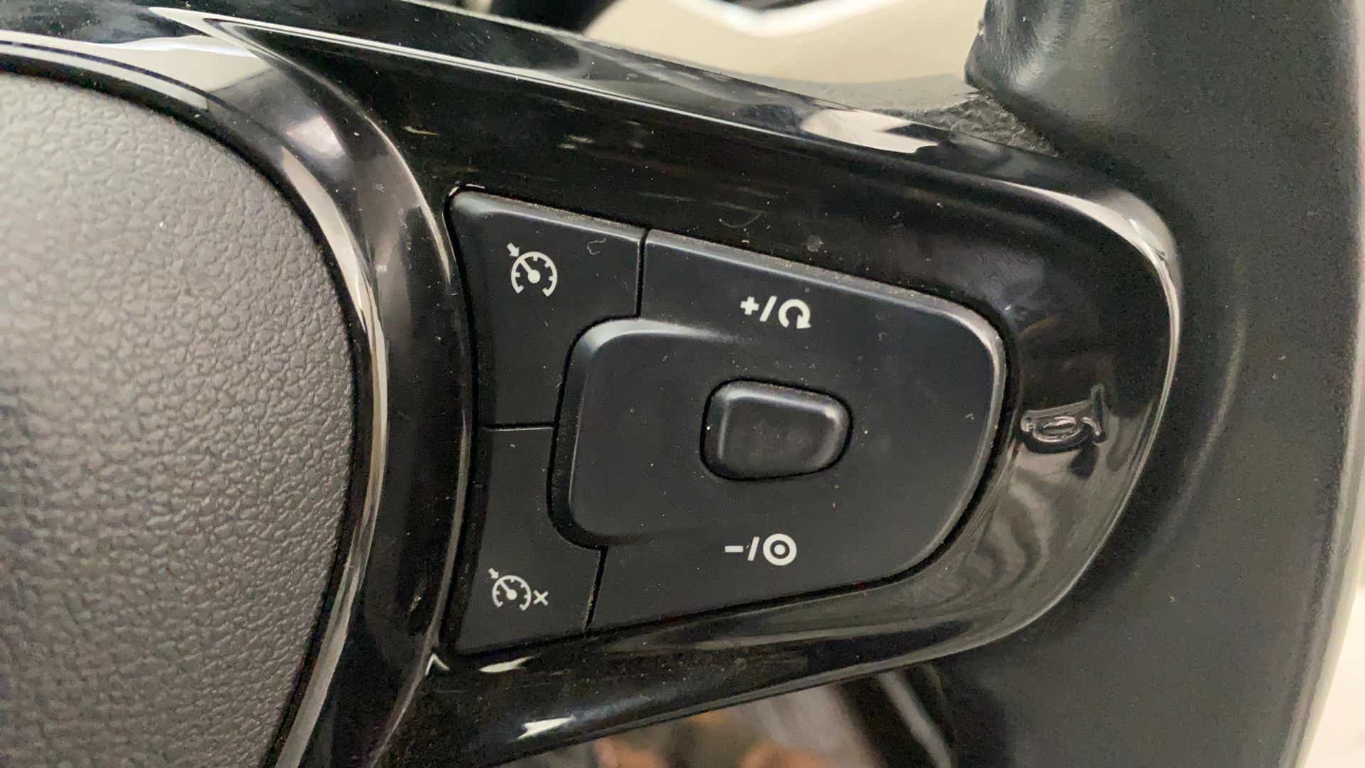 Steering wheel cruise control buttons of a Tata Nexon 2017-2023