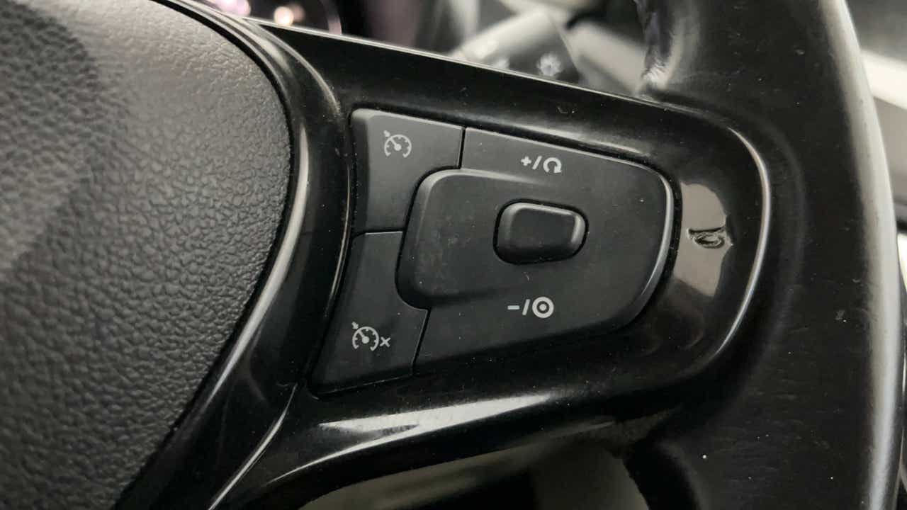 Steering wheel cruise control buttons of a Tata Nexon 2017-2023