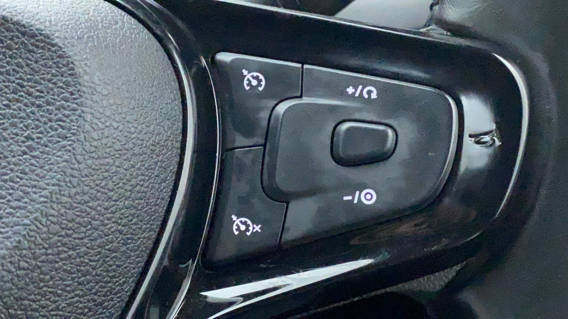 Cruise control buttons on a Tata Nexon 2017-2023 steering wheel