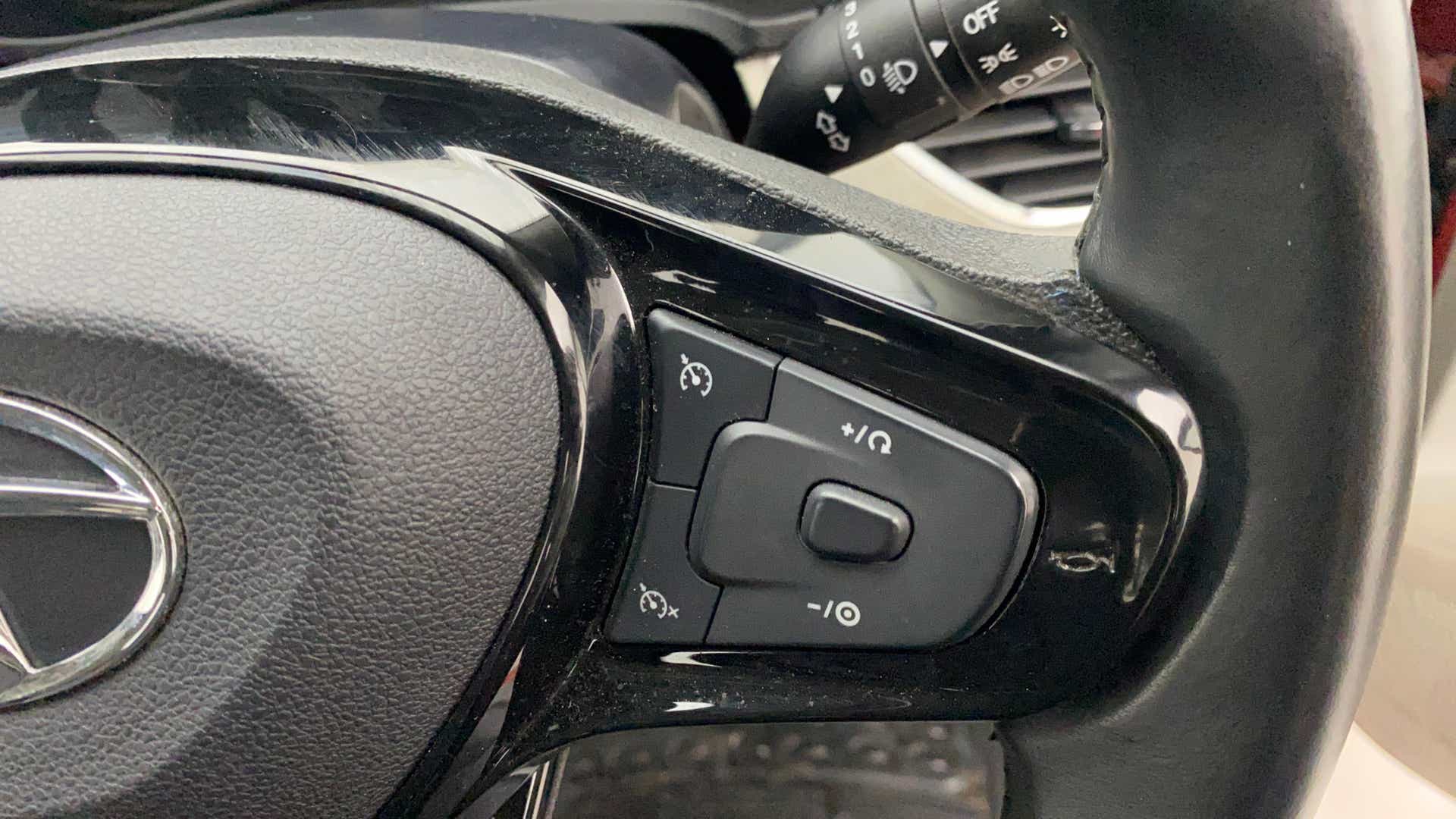 Steering wheel control close-up of a Tata Nexon 2017-2023