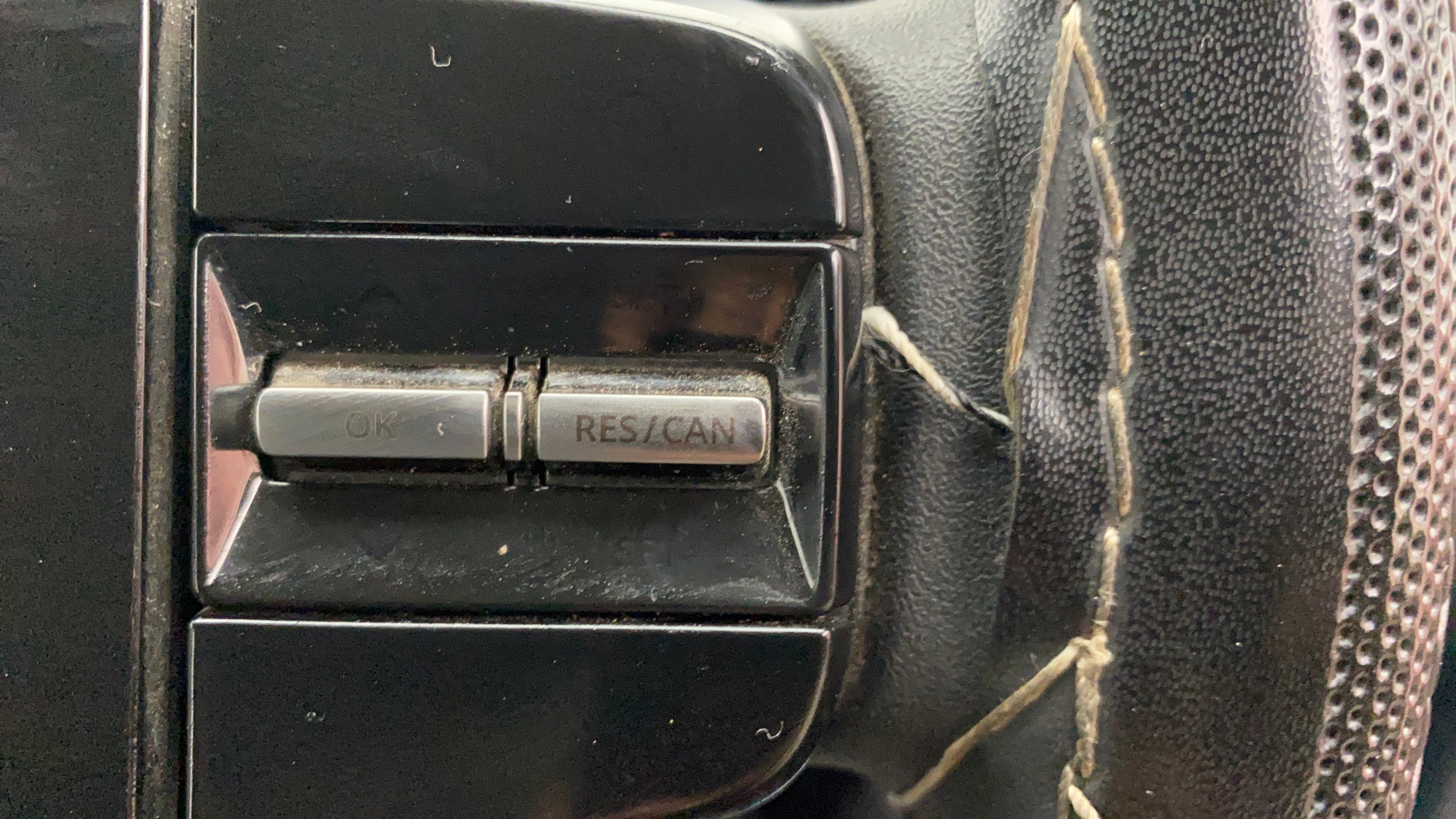 Steering wheel cruise control buttons of a Tata Nexon 2017-2023