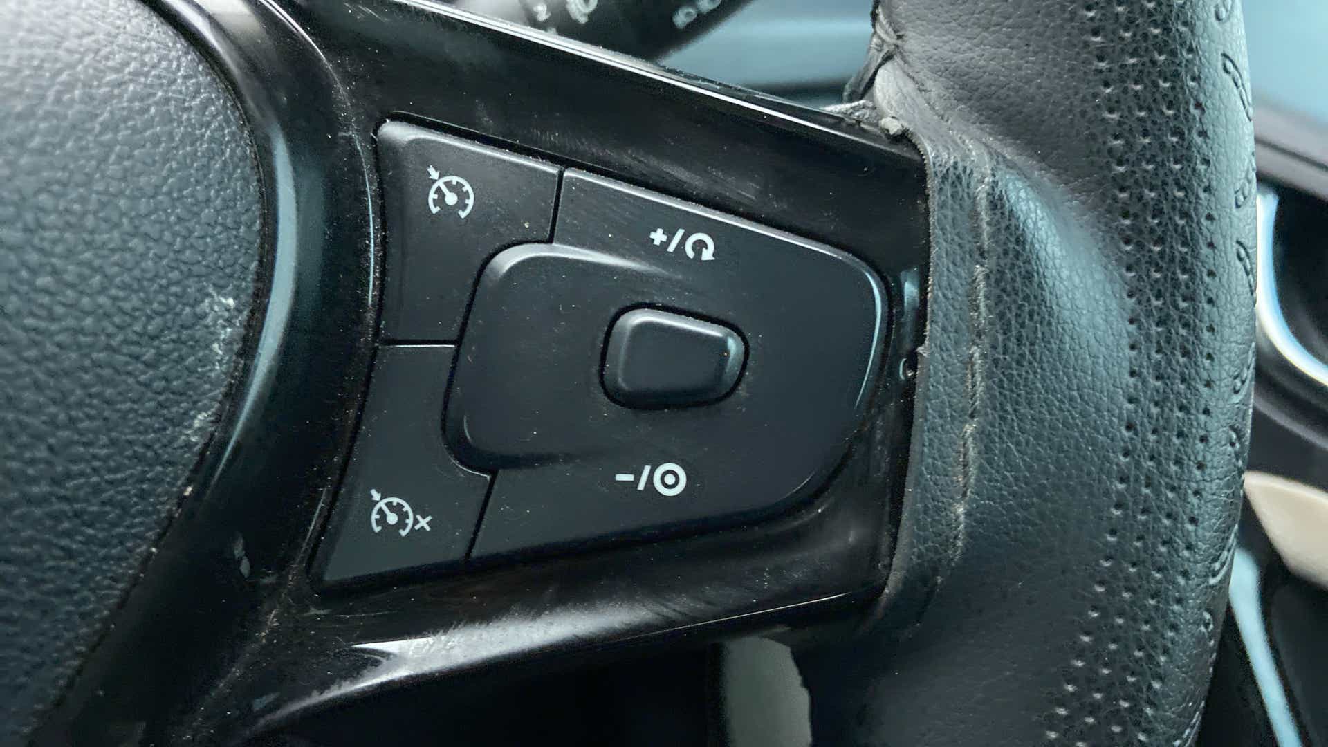 Steering wheel cruise control buttons of a Tata Nexon 2017-2023