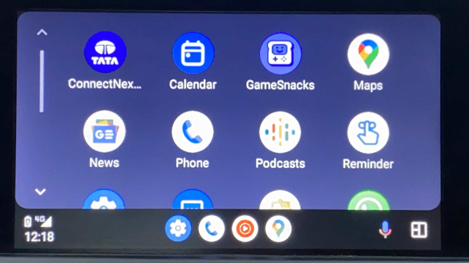 Infotainment touchscreen display showing app icons of a Tata Nexon 2017-2023
