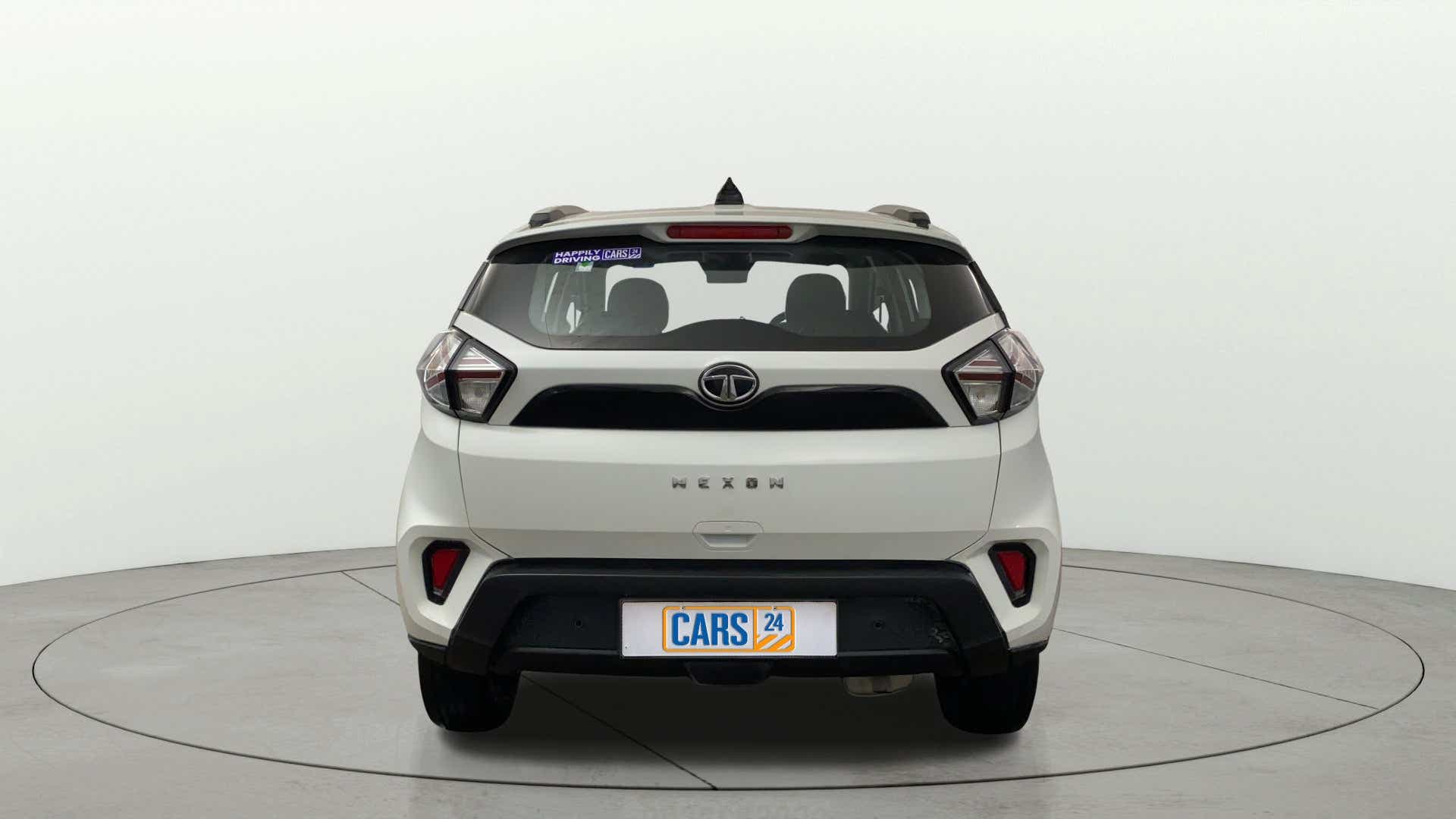 Rear view of a calgary-white Tata Nexon 2017-2023