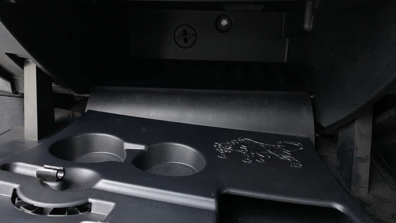 Interior cup holder area of a Tata Nexon 2017-2023