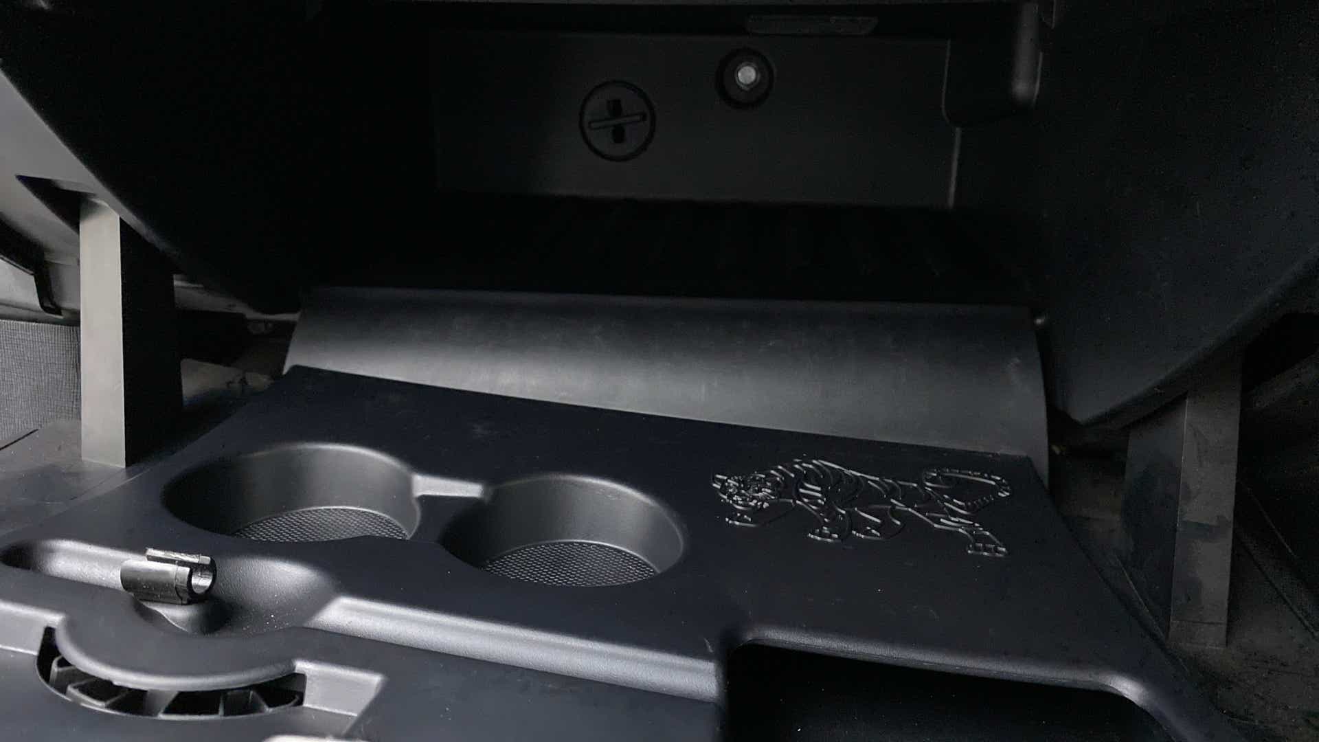 Interior cup holder area of a Tata Nexon 2017-2023