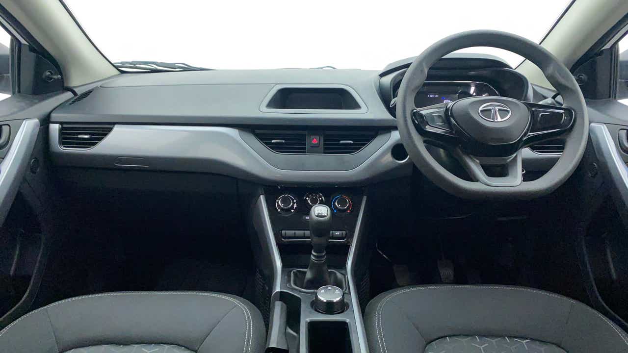 Dashboard and steering wheel view of a Tata Nexon 2017-2023