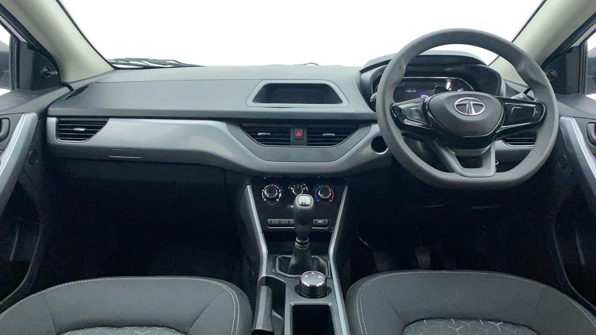 Dashboard and steering wheel view of a Tata Nexon 2017-2023