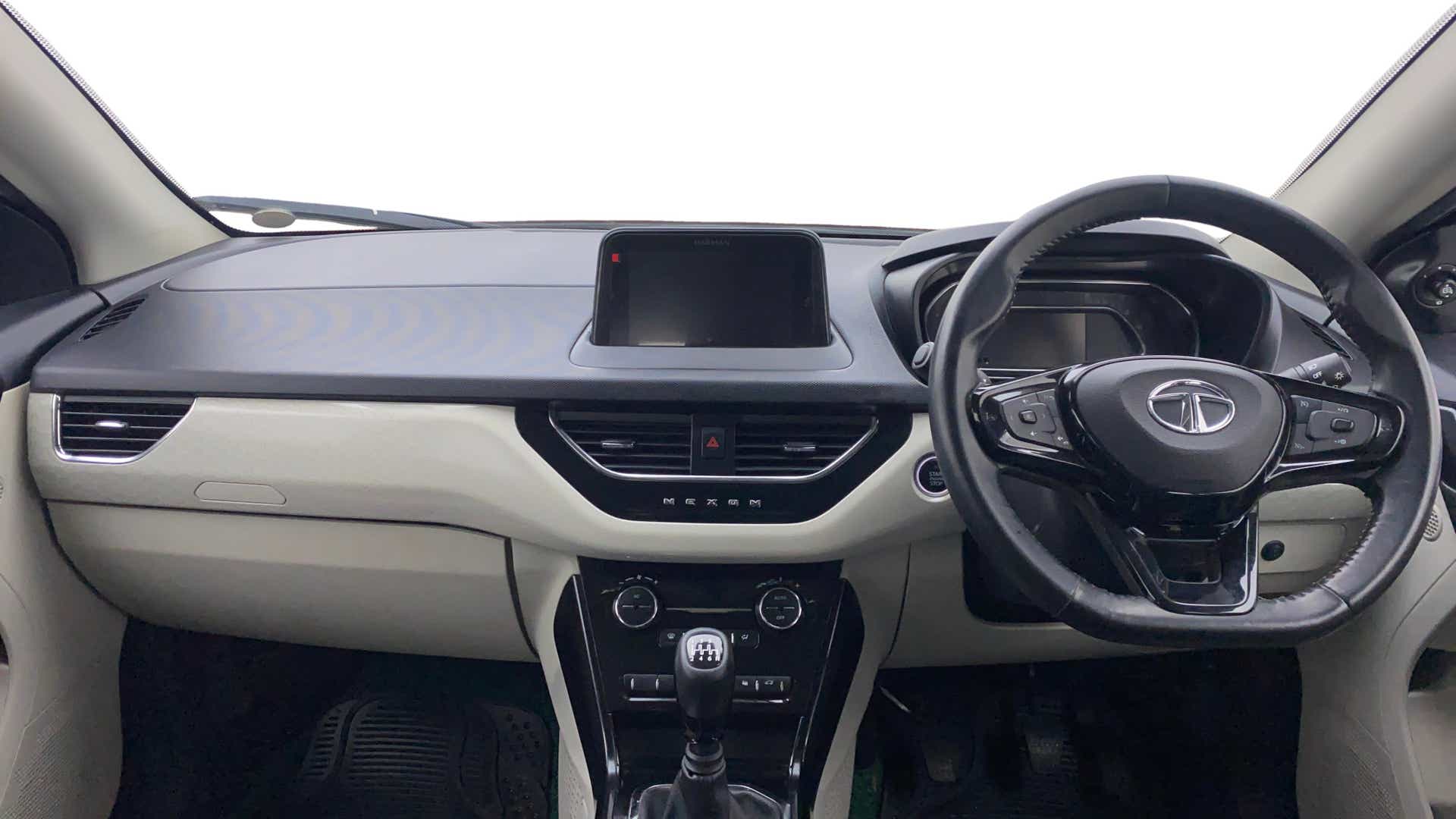 Dashboard and steering wheel view of a Tata Nexon 2017-2023