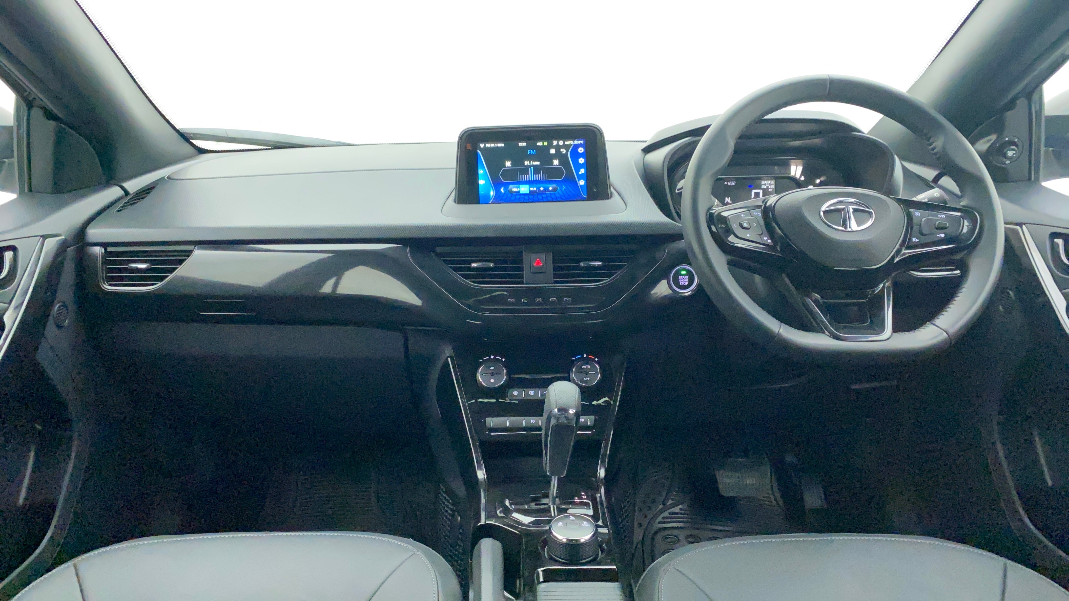 Dashboard and steering wheel view of a Tata Nexon 2017-2023