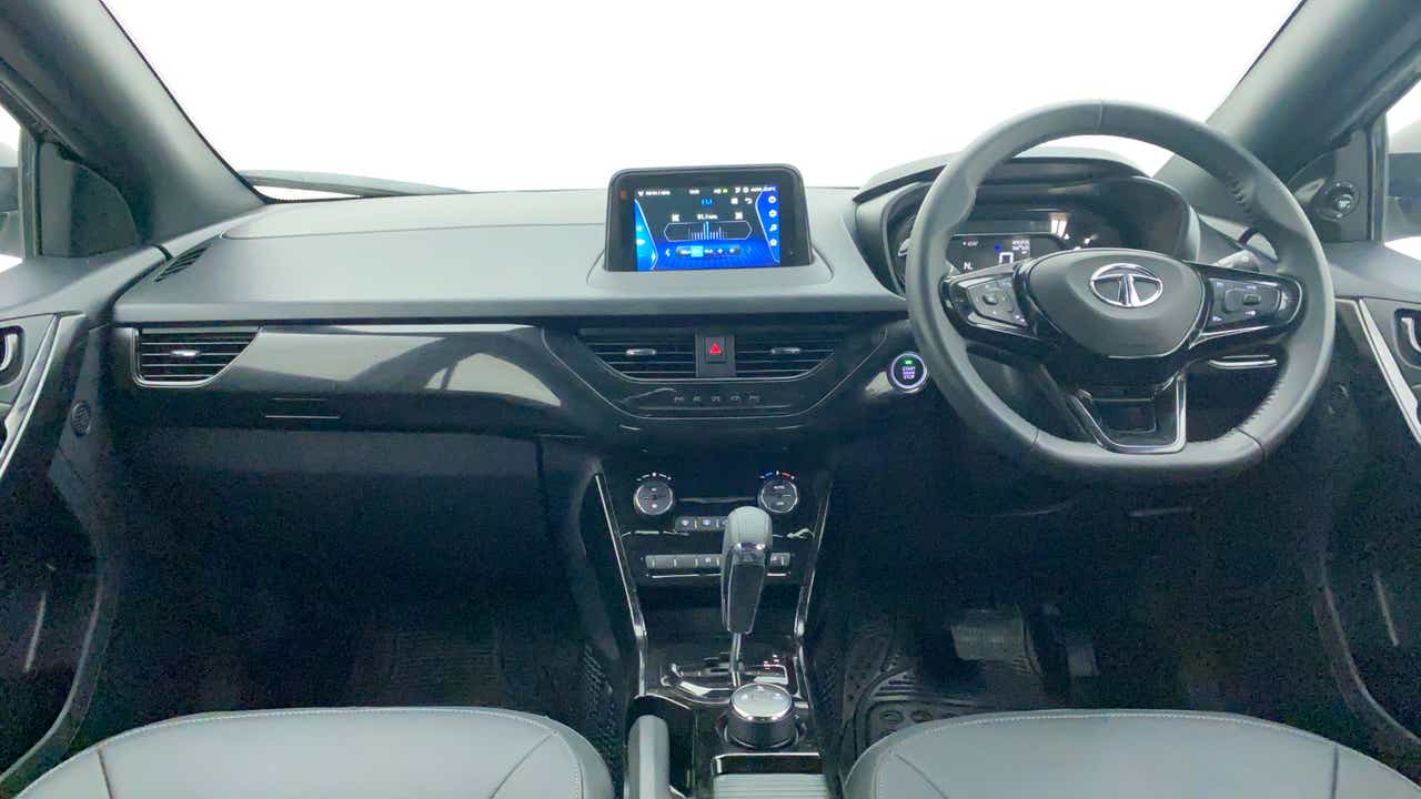 Dashboard and steering wheel view of a Tata Nexon 2017-2023