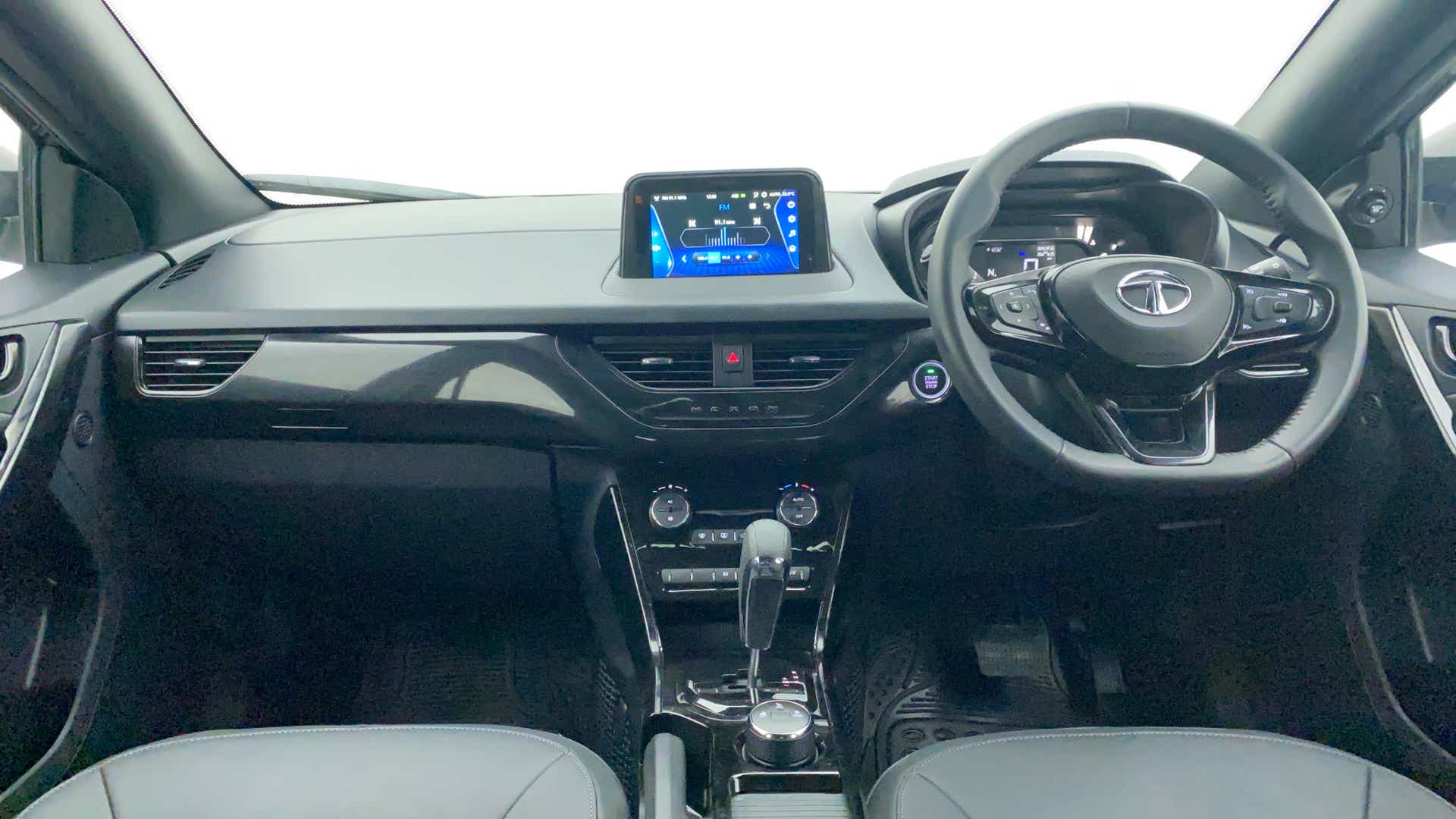 Dashboard and steering wheel view of a Tata Nexon 2017-2023