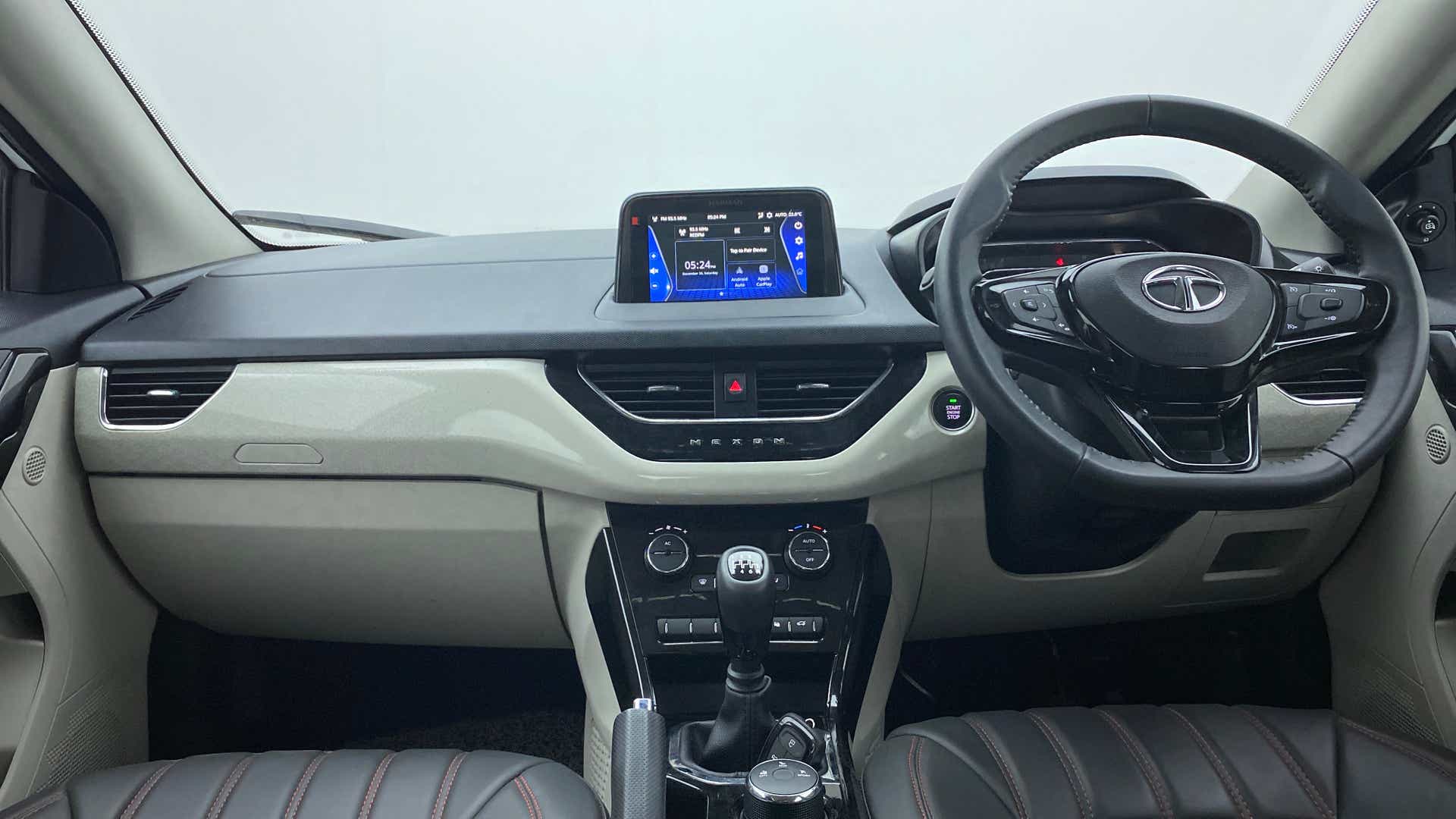 Dashboard and steering wheel view of a Tata Nexon 2017-2023